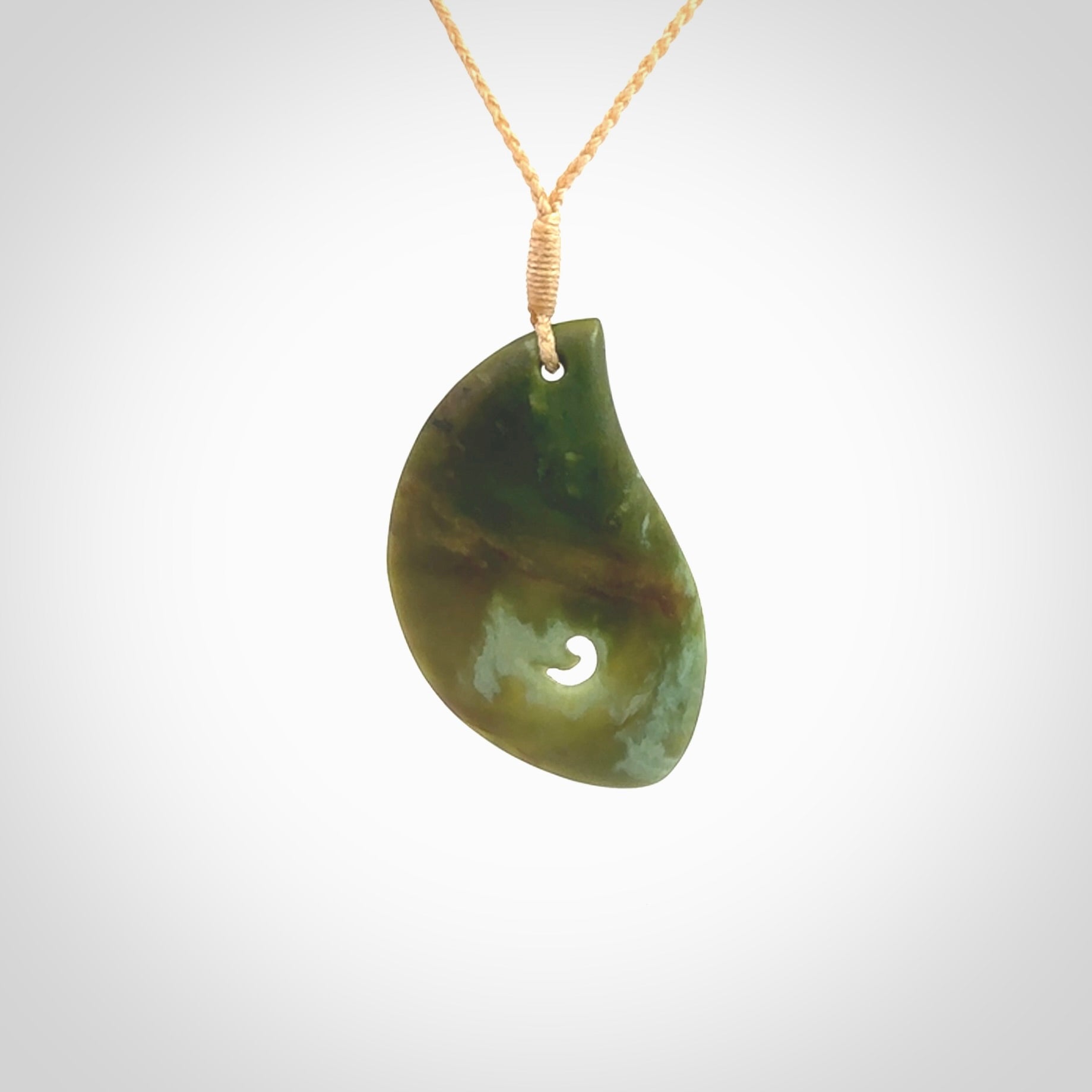 This pendant is a medium sized leaf drop design with koru heart necklace carved from a gorgeous piece of New Zealand Jade. Kyohei Noguchi carved this piece for us so the workmanship is outstanding. Handmade in New Zealand, a beautiful piece of jade jewellery.