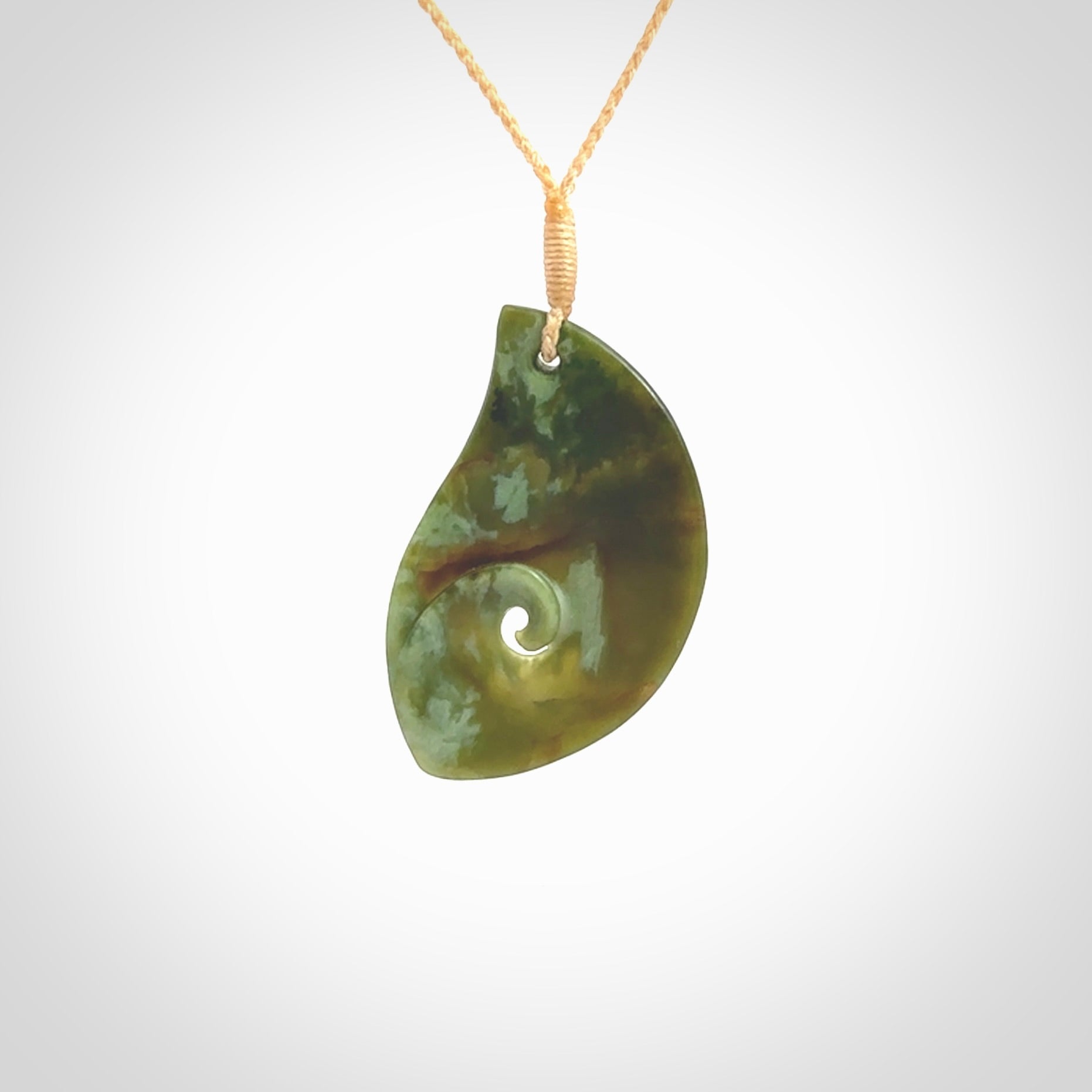 This pendant is a medium sized leaf drop design with koru heart necklace carved from a gorgeous piece of New Zealand Jade. Kyohei Noguchi carved this piece for us so the workmanship is outstanding. Handmade in New Zealand, a beautiful piece of jade jewellery.