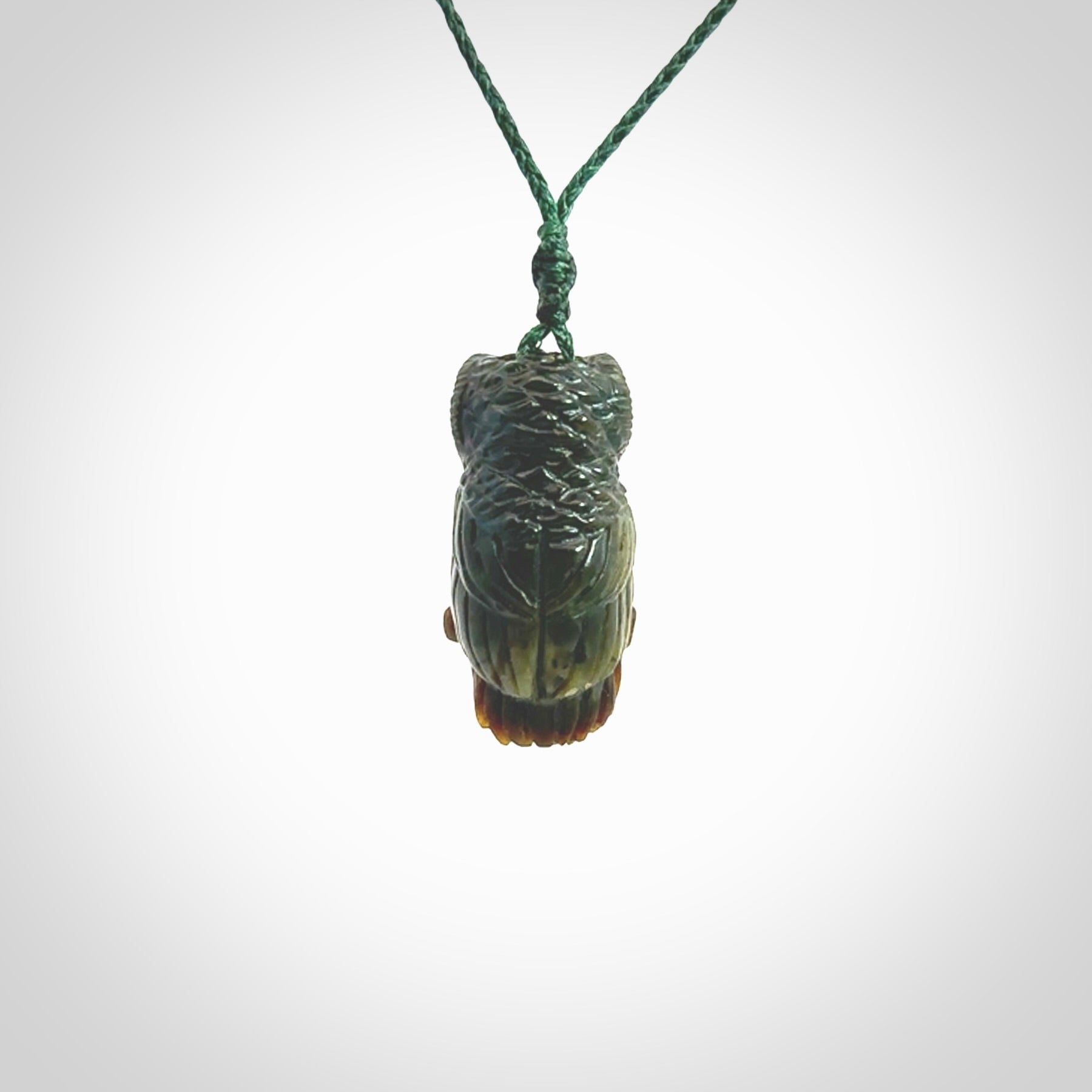 A traditional Owl design carving, hand made for us from Jade. This is a work of art and is a collectable piece of traditional Jade carving. It can be worn as a special piece of jewellery or displayed. This is art made to wear at its finest.