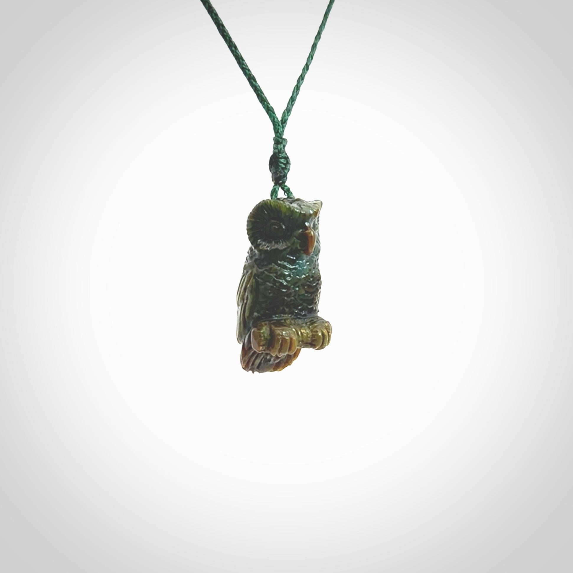 A traditional Owl design carving, hand made for us from Jade. This is a work of art and is a collectable piece of traditional Jade carving. It can be worn as a special piece of jewellery or displayed. This is art made to wear at its finest.