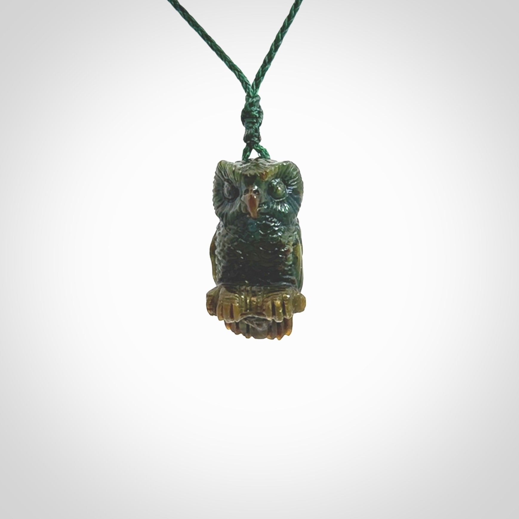 A traditional Owl design carving, hand made for us from Jade. This is a work of art and is a collectable piece of traditional Jade carving. It can be worn as a special piece of jewellery or displayed. This is art made to wear at its finest.