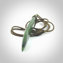 Hand carved from a lovely piece of local New Zealand Marsden Jade. The quality of the workmanship and design is outstanding - this is a piece you will want to wear all the time. We have suspended this from a 4-plait olive cord which can be adjusted with a couple of slip knots and olive binding. Hand made by Kyohei Noguchi.