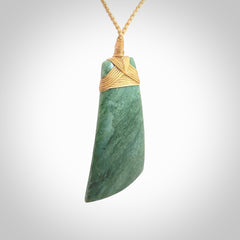 Hand carved from a lovely piece of local New Zealand Jade. The quality of the workmanship and design is outstanding - this is a piece you will want to wear all the time. We have suspended this from a 4-plait beige cord which can be adjusted with a couple of slip knots and beige binding. Hand made by Kyohei Noguchi.