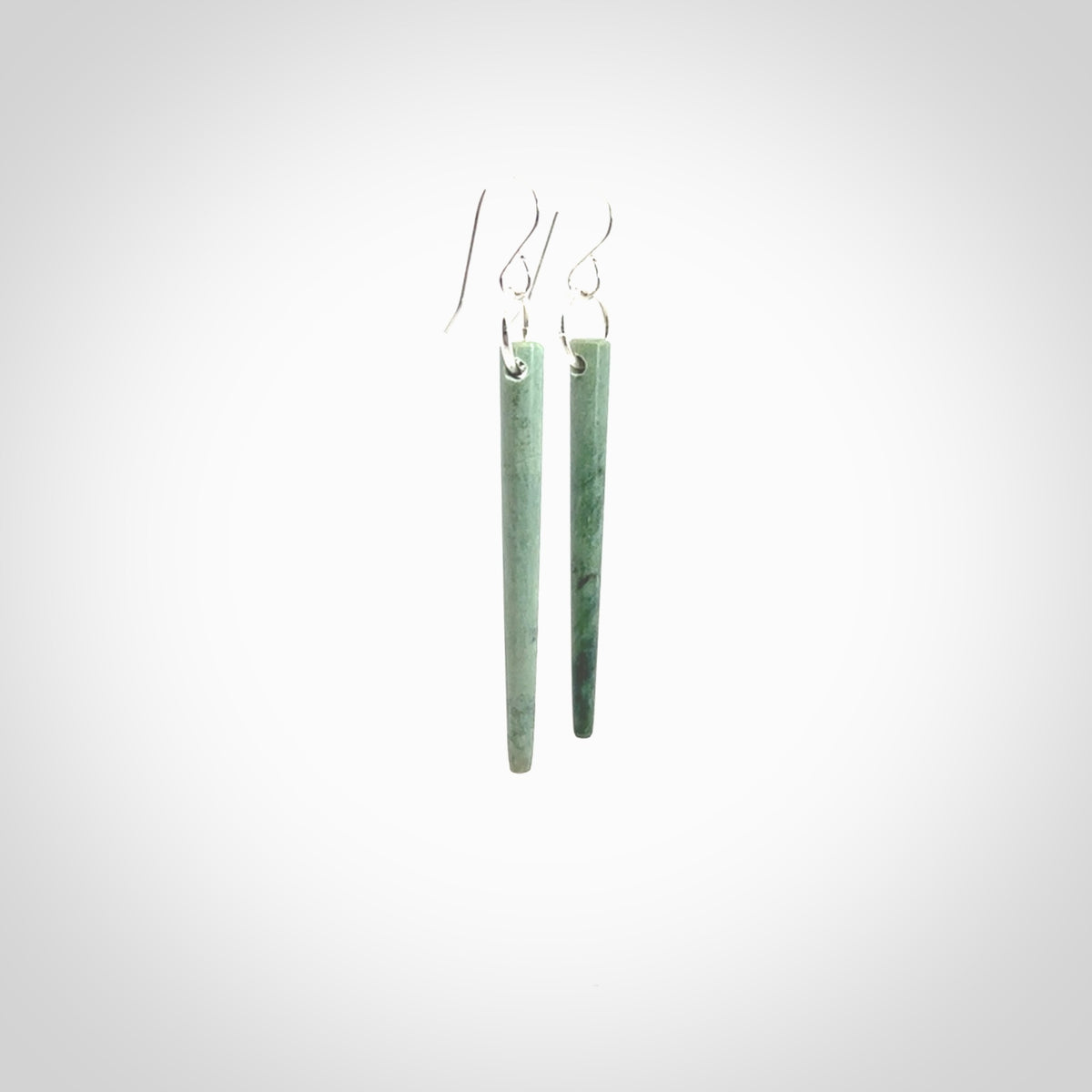 Hand crafted New Zealand Jade Inanga Jade drop earrings with Sterling Silver Hooks. Jade drop earrings, packaged in a woven kete pouch.