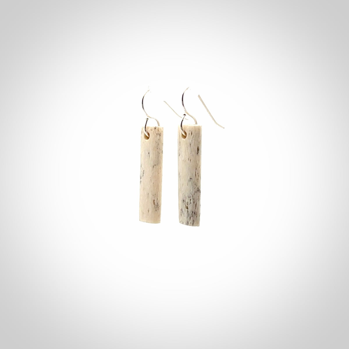 Hand carved medium whalebone drop earrings hand made by Kristal Thompson. One only large whale bone drop earrings. Real whale bone art to wear. Free Shipping worldwide. One pair only, delivered in a kete pouch.