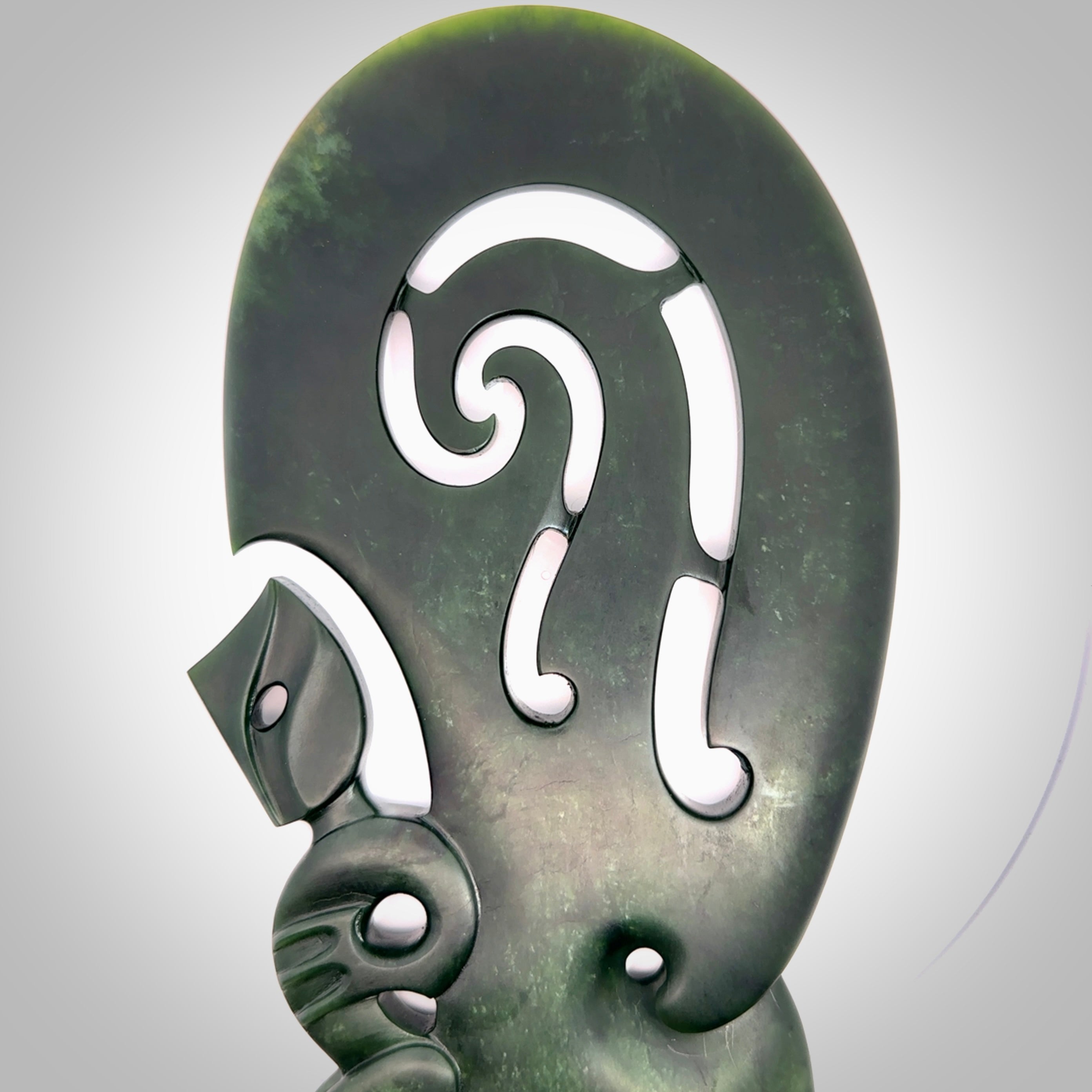 Hand carved wahaika Pounamu. Art to display. One only hand made wahaika display piece with base. New Zealand wahaika carved in Pounamu, Jade by Kerry Thompson. Free delivery worldwide.