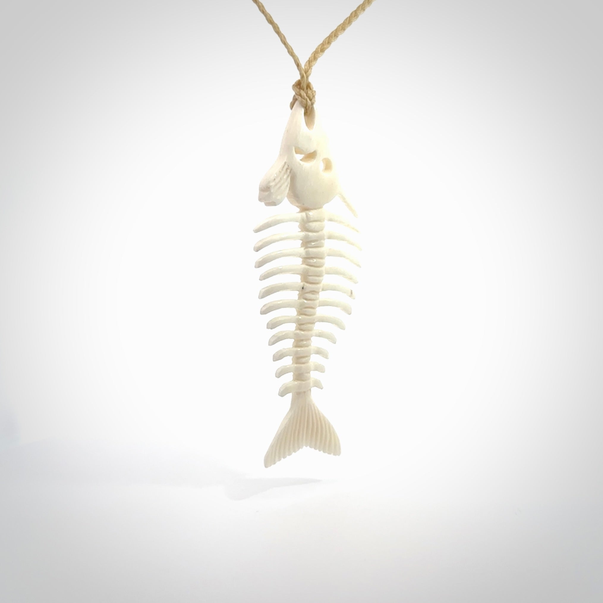 Hand carved bone fish skeleton pendant. Hand made bone fish necklace. Fish themed jewellery. Ocean themed pendant. One only necklace provided with adjustable cord and free delivery.