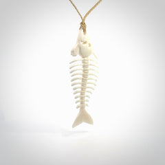 Hand carved bone fish skeleton pendant. Hand made bone fish necklace. Fish themed jewellery. Ocean themed pendant. One only necklace provided with adjustable cord and free delivery.