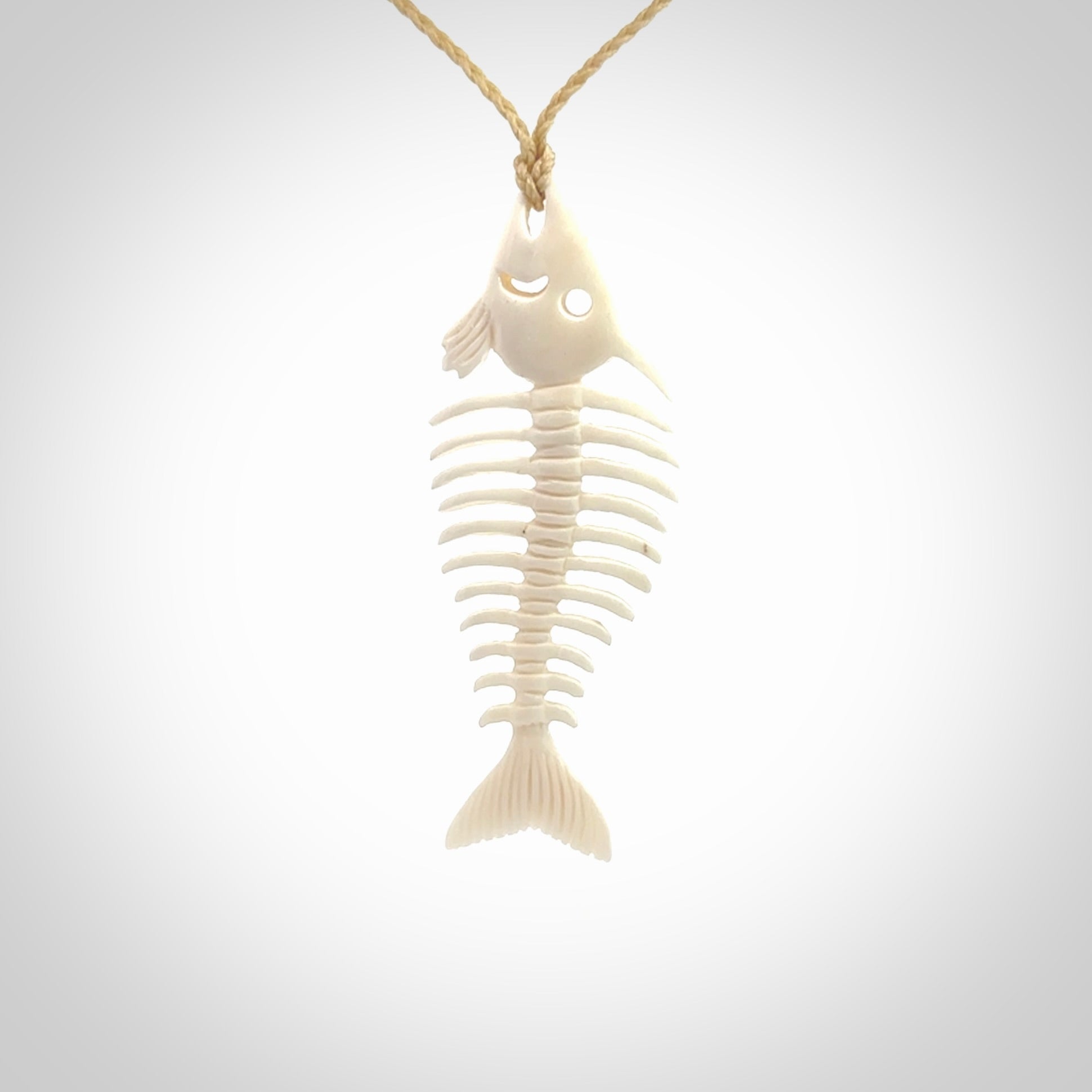 Hand carved bone fish skeleton pendant. Hand made bone fish necklace. Fish themed jewellery. Ocean themed pendant. One only necklace provided with adjustable cord and free delivery.