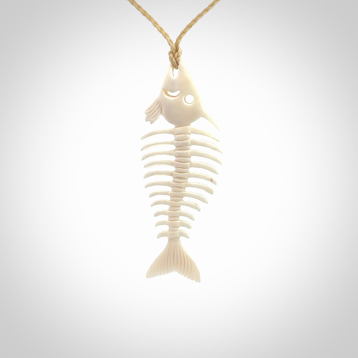 Hand carved bone fish skeleton pendant. Hand made bone fish necklace. Fish themed jewellery. Ocean themed pendant. One only necklace provided with adjustable cord and free delivery.