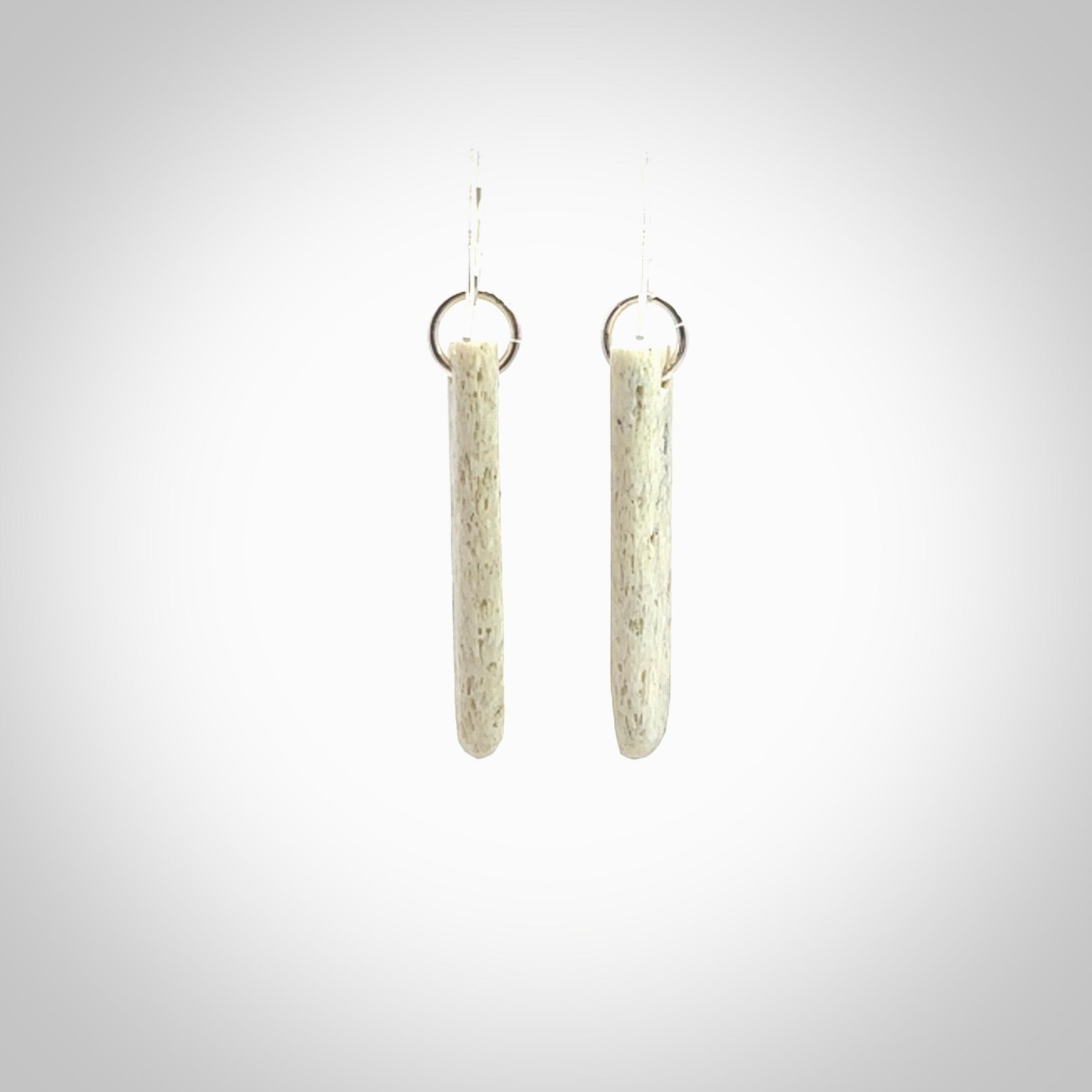 Hand carved medium whalebone drop earrings hand made by Kristal Thompson. One only whale bone drop earrings. Real whale bone art to wear. Free Shipping worldwide. One pair only, delivered in a kete pouch.