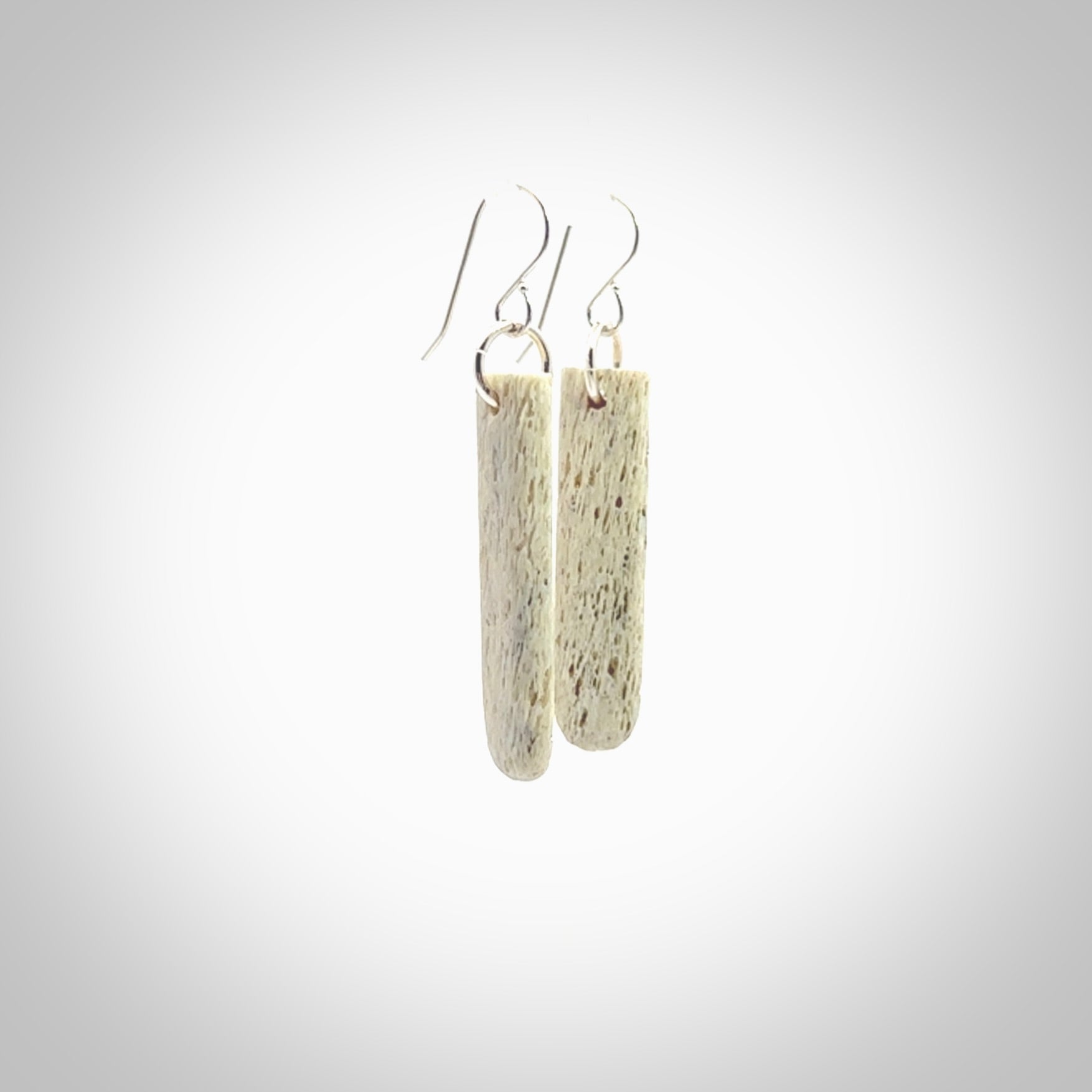 Hand carved medium whalebone drop earrings hand made by Kristal Thompson. One only whale bone drop earrings. Real whale bone art to wear. Free Shipping worldwide. One pair only, delivered in a kete pouch.