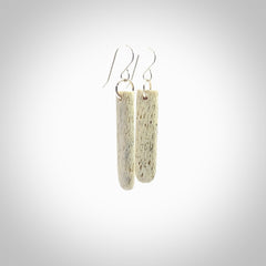 Hand carved medium whalebone drop earrings hand made by Kristal Thompson. One only whale bone drop earrings. Real whale bone art to wear. Free Shipping worldwide. One pair only, delivered in a kete pouch.