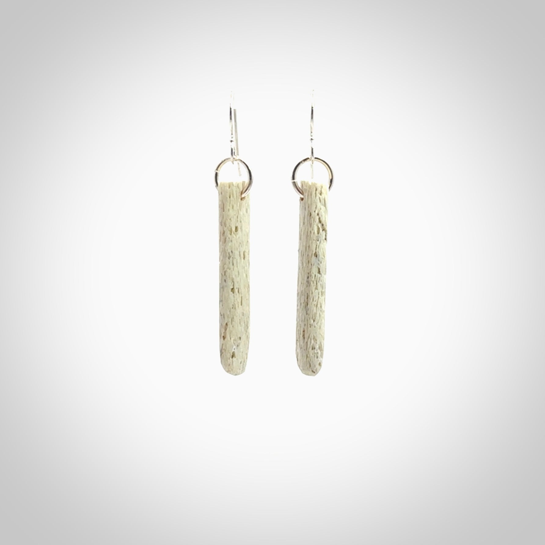 Hand carved medium whalebone drop earrings hand made by Kristal Thompson. One only whale bone drop earrings. Real whale bone art to wear. Free Shipping worldwide. One pair only, delivered in a kete pouch.