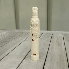 A contemporary hand carved flute. This piece is made from bone and is a fully functioning musical instrument and can be played. Beautiful art hand made by Yuri Terenyi. Flute with Dragons head.