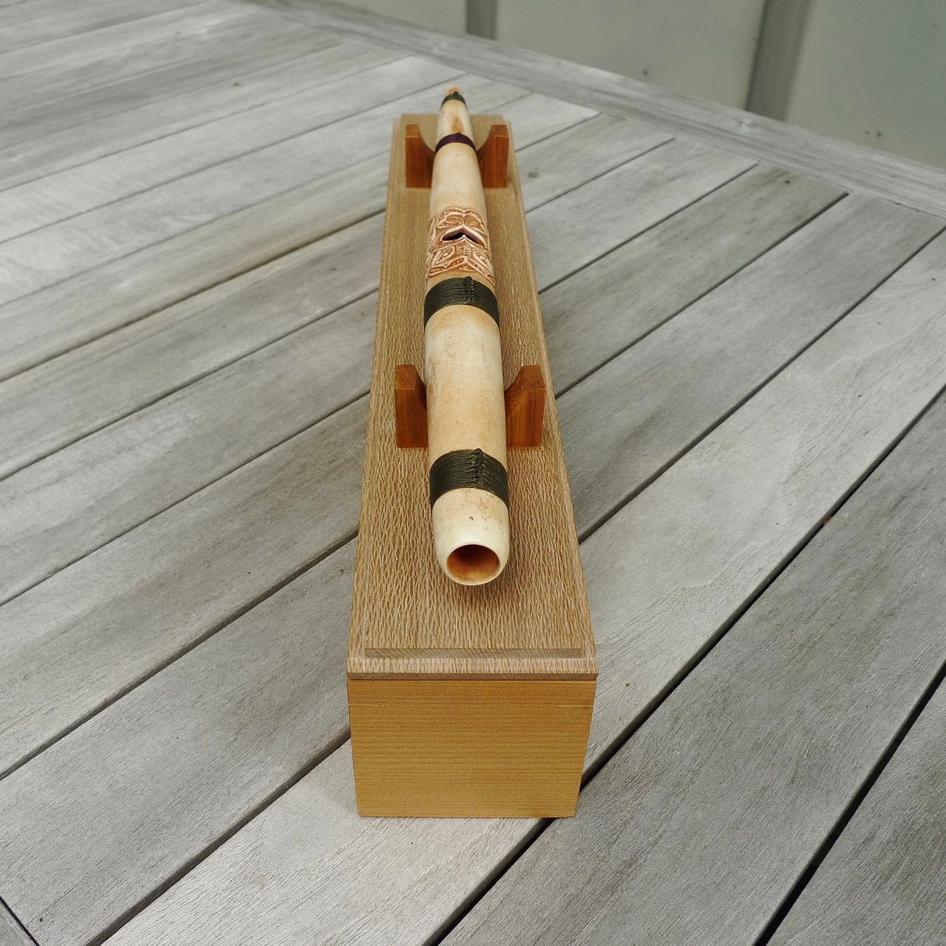 A traditional hand carved Māori flute. This piece is made from bone and is a fully functioning musical instrument and can be played. Beautiful ethnic art hand made by NZ Pacific. One off flute hand made by Yuri Terenyi.