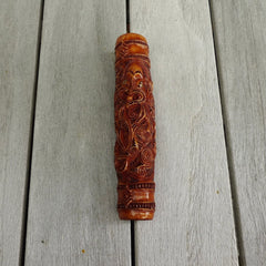 A traditional hand carved Māori flute. This piece is made from bone and is a fully functioning musical instrument and can be played. Beautiful ethnic art hand made by NZ Pacific. Hand made by Yuri Terenyi, one only stained bone flute instrument. Traditional art from New Zealand.