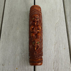 A traditional hand carved Māori flute. This piece is made from stained bone and is a fully functioning musical instrument and can be played. Beautiful ethnic art hand made by NZ Pacific. Hand carved by Yuri Terenyi.