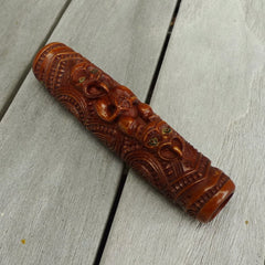 A traditional hand carved Māori flute. This piece is made from stained bone and is a fully functioning musical instrument and can be played. Beautiful ethnic art hand made by NZ Pacific. Hand carved by Yuri Terenyi.