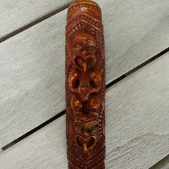 A traditional hand carved Māori flute. This piece is made from stained bone and is a fully functioning musical instrument and can be played. Beautiful ethnic art hand made by NZ Pacific. Hand carved by Yuri Terenyi.