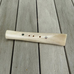 A traditional hand carved Māori flute. This piece is made from bone and is a fully functioning musical instrument and can be played. Beautiful ethnic art hand made by NZ Pacific.