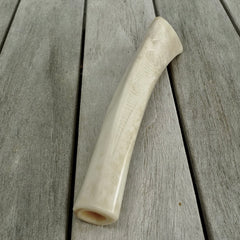 A traditional hand carved Māori flute. This piece is made from bone and is a fully functioning musical instrument and can be played. Beautiful ethnic art hand made by NZ Pacific.