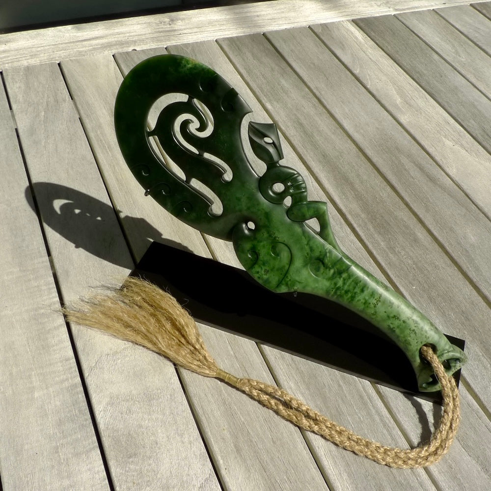 Hand carved wahaika Pounamu. Art to display. One only hand made wahaika display piece with base. New Zealand wahaika carved in Pounamu, Jade by Kerry Thompson. Free delivery worldwide.