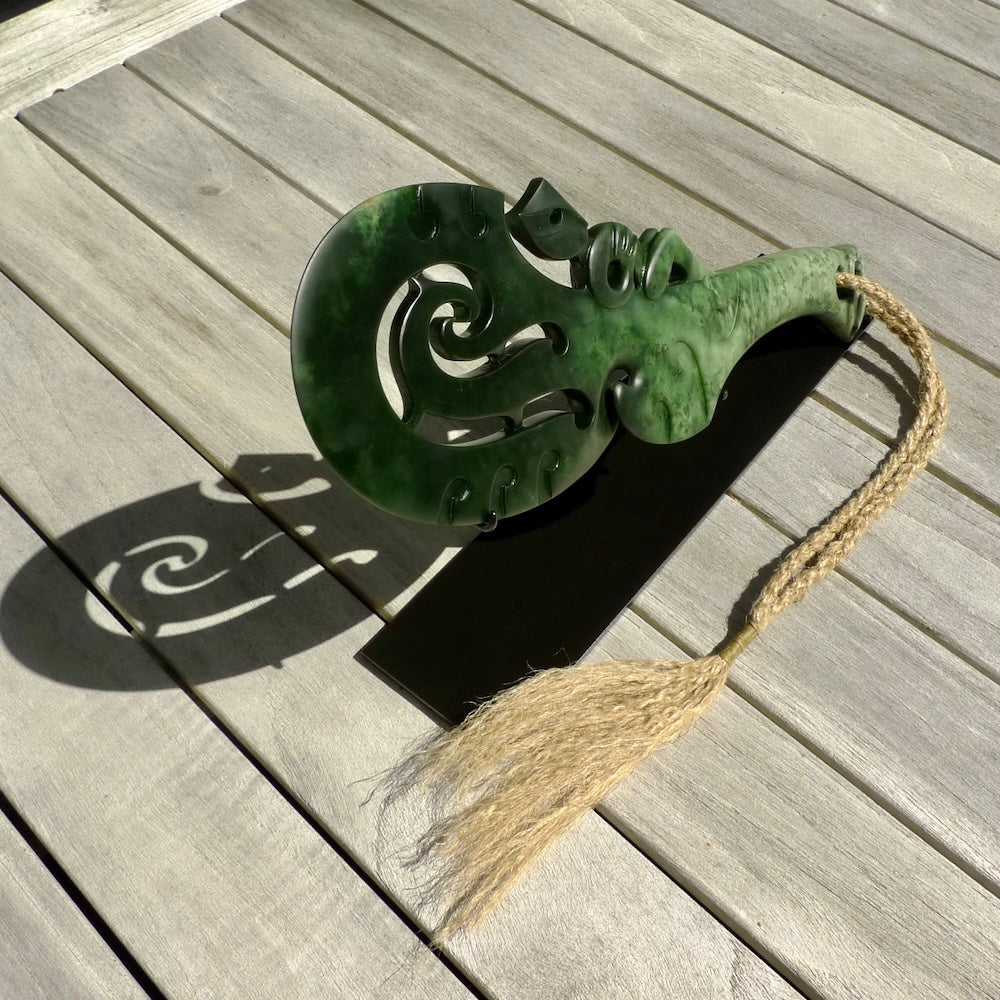 Hand carved wahaika Pounamu. Art to display. One only hand made wahaika display piece with base. New Zealand wahaika carved in Pounamu, Jade by Kerry Thompson. Free delivery worldwide.