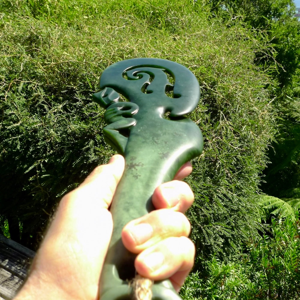 Hand carved wahaika Pounamu. Art to display. One only hand made wahaika display piece with base. New Zealand wahaika carved in Pounamu, Jade by Kerry Thompson. Free delivery worldwide.