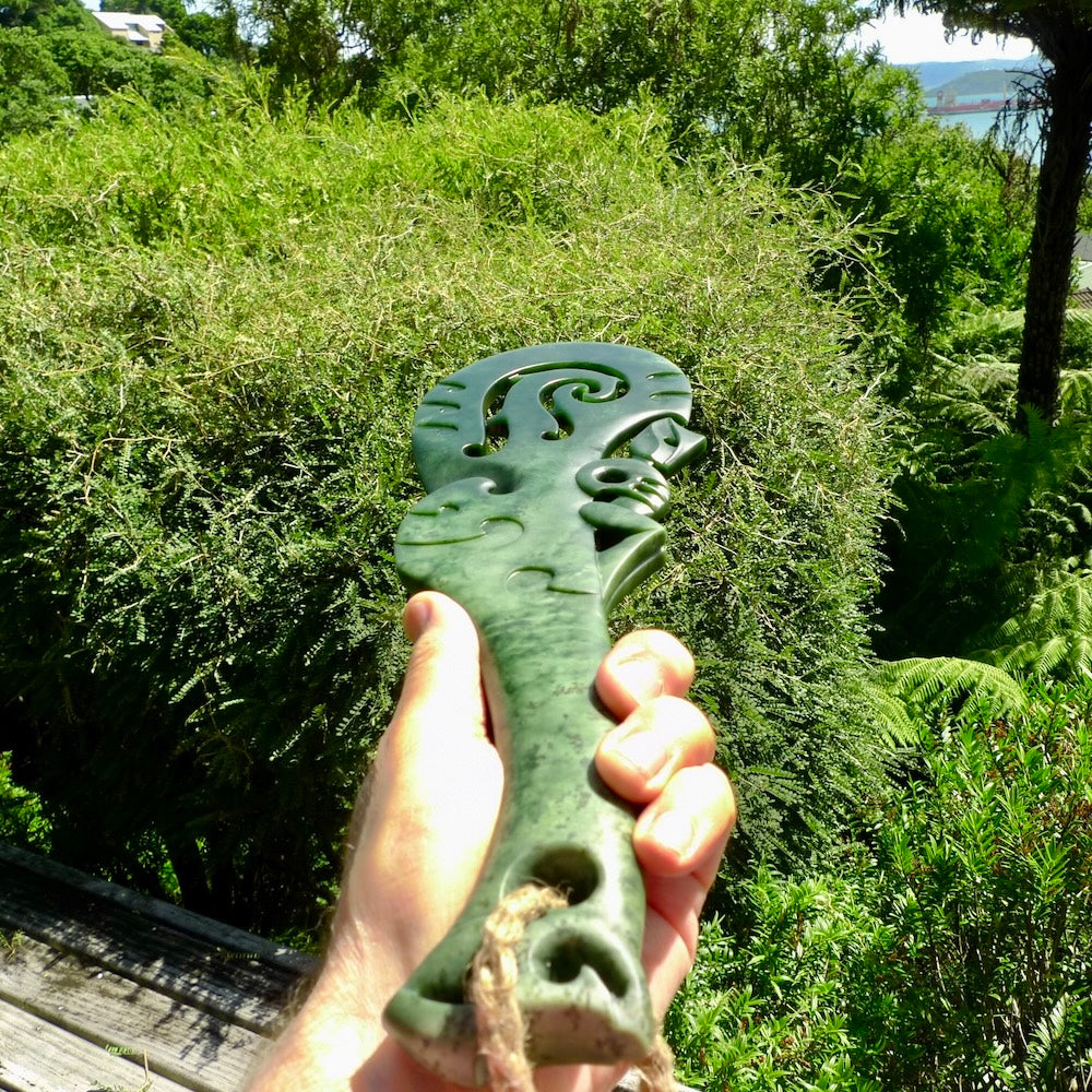 Hand carved wahaika Pounamu. Art to display. One only hand made wahaika display piece with base. New Zealand wahaika carved in Pounamu, Jade by Kerry Thompson. Free delivery worldwide.