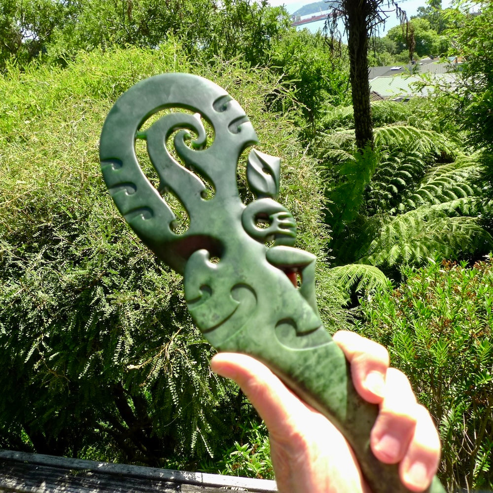 Hand carved wahaika Pounamu. Art to display. One only hand made wahaika display piece with base. New Zealand wahaika carved in Pounamu, Jade by Kerry Thompson. Free delivery worldwide.