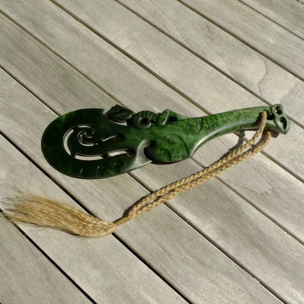 Hand carved wahaika Pounamu. Art to display. One only hand made wahaika display piece with base. New Zealand wahaika carved in Pounamu, Jade by Kerry Thompson. Free delivery worldwide.