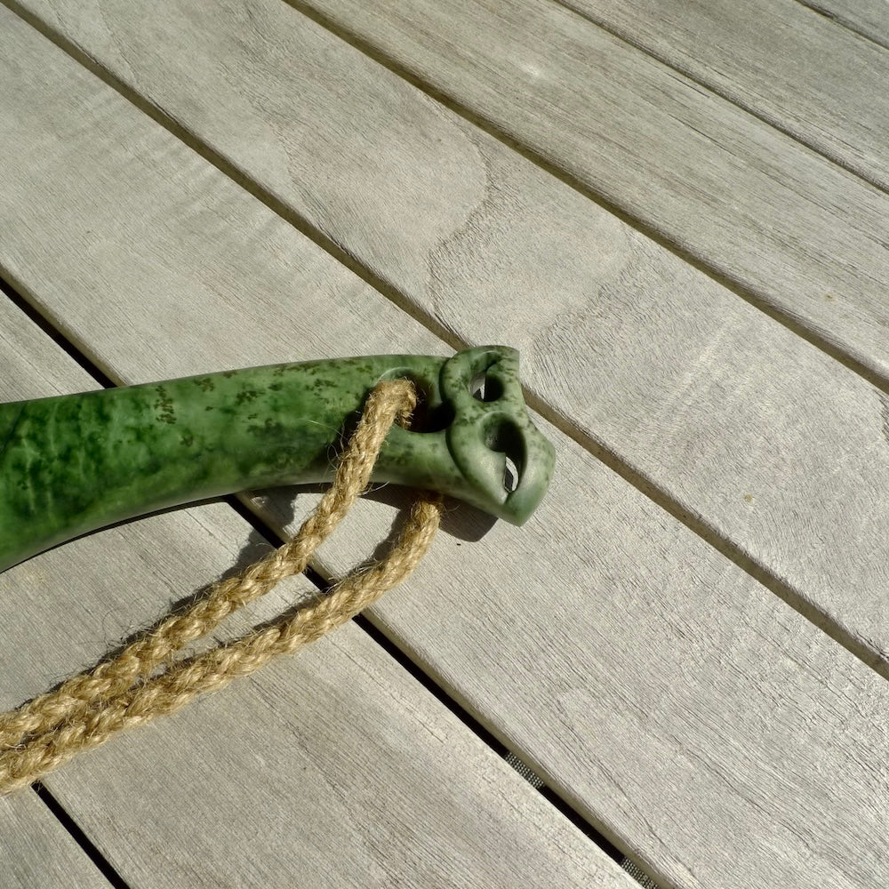 Hand carved wahaika Pounamu. Art to display. One only hand made wahaika display piece with base. New Zealand wahaika carved in Pounamu, Jade by Kerry Thompson. Free delivery worldwide.