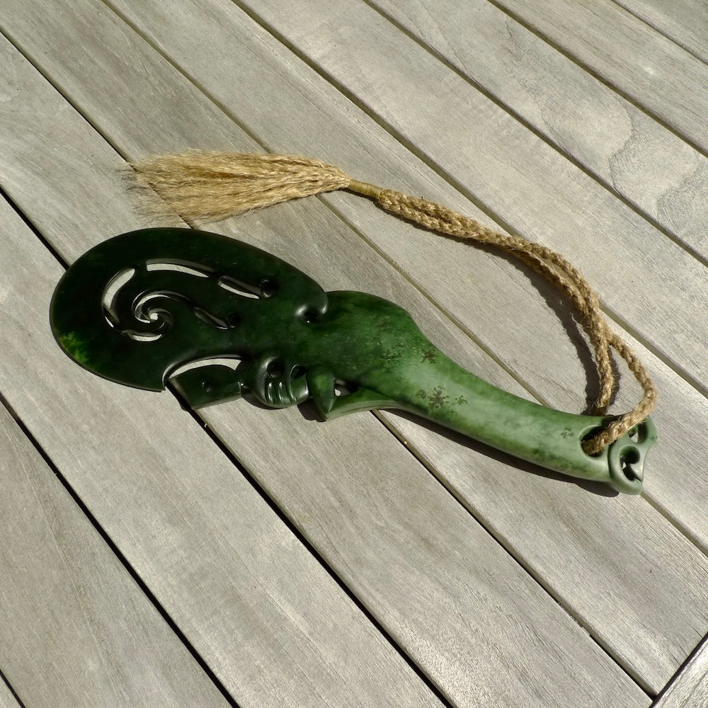 Hand carved wahaika Pounamu. Art to display. One only hand made wahaika display piece with base. New Zealand wahaika carved in Pounamu, Jade by Kerry Thompson. Free delivery worldwide.