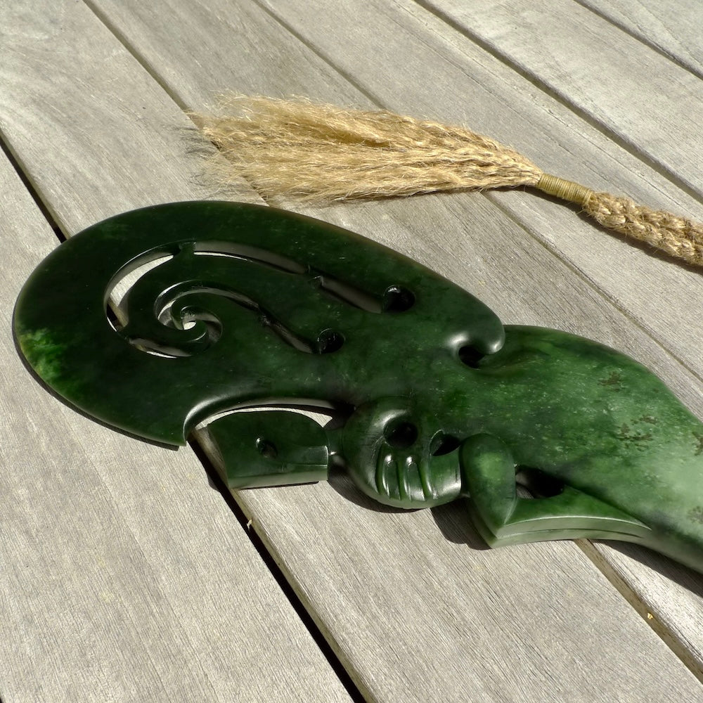 Hand carved wahaika Pounamu. Art to display. One only hand made wahaika display piece with base. New Zealand wahaika carved in Pounamu, Jade by Kerry Thompson. Free delivery worldwide.