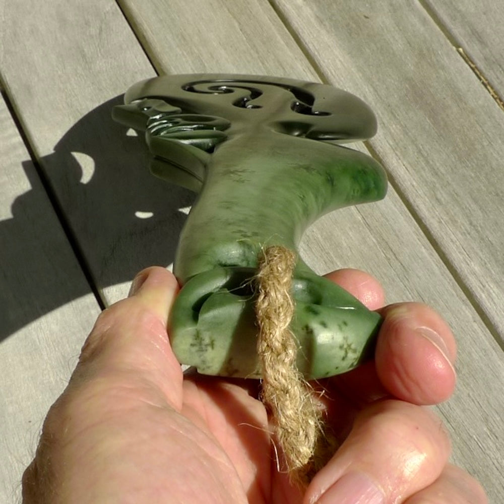 Hand carved wahaika Pounamu. Art to display. One only hand made wahaika display piece with base. New Zealand wahaika carved in Pounamu, Jade by Kerry Thompson. Free delivery worldwide.