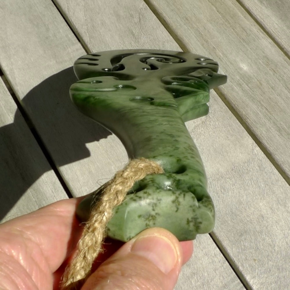 Hand carved wahaika Pounamu. Art to display. One only hand made wahaika display piece with base. New Zealand wahaika carved in Pounamu, Jade by Kerry Thompson. Free delivery worldwide.