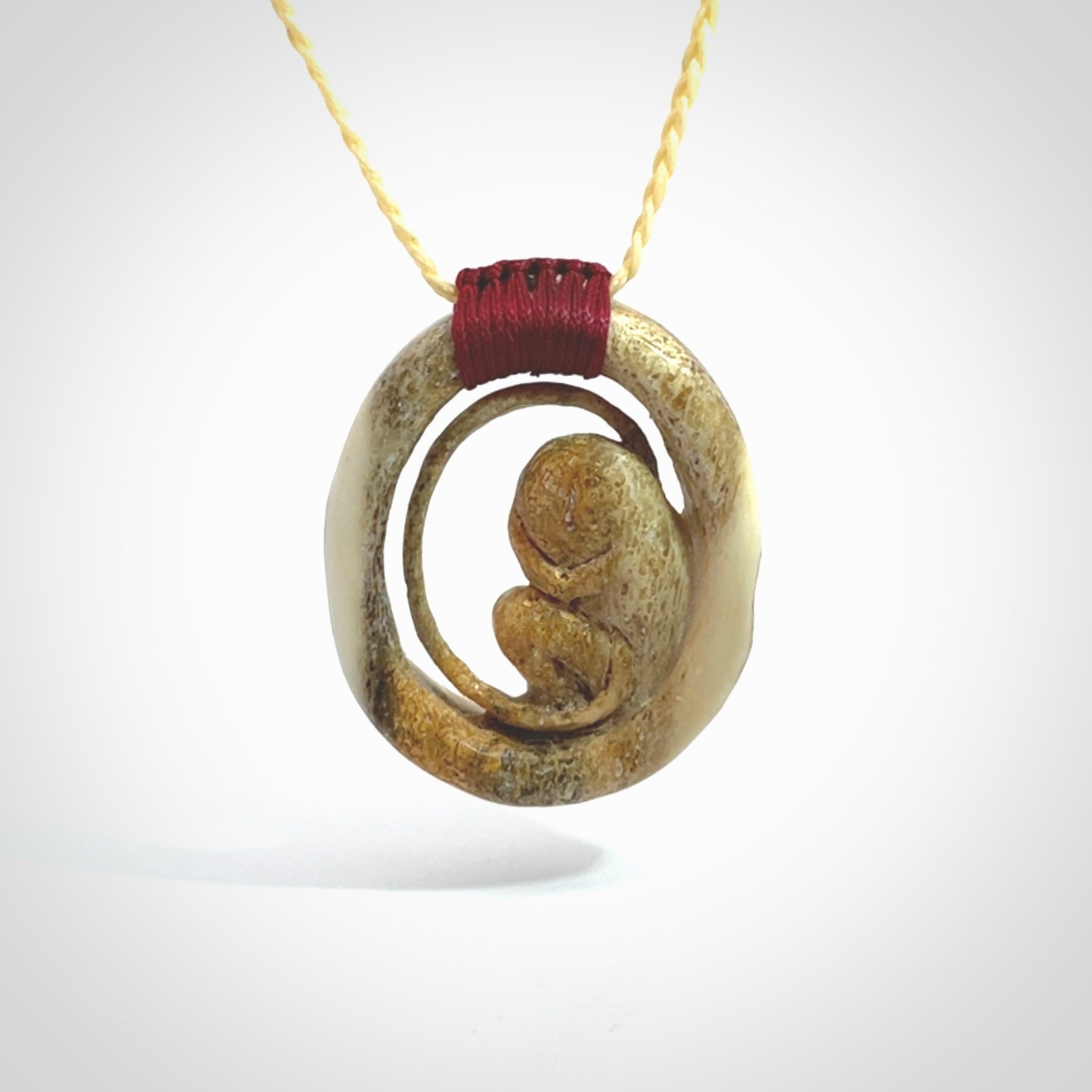 Hand carved deer antler fetus pendant. Hand carved by NZ Pacific. Free postage worldwide. Hand made fetus necklace from deer antler. Fetus necklace for men and women. Delivered with adjustable and packaged in a woven kete pouch.