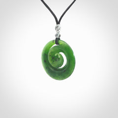 Hand carved New Zealand Kawakawa jade koru pendant. Carved for NZ Pacific by Ross Crump. Jade jewelry for sale online exclusively with NZ Pacific.