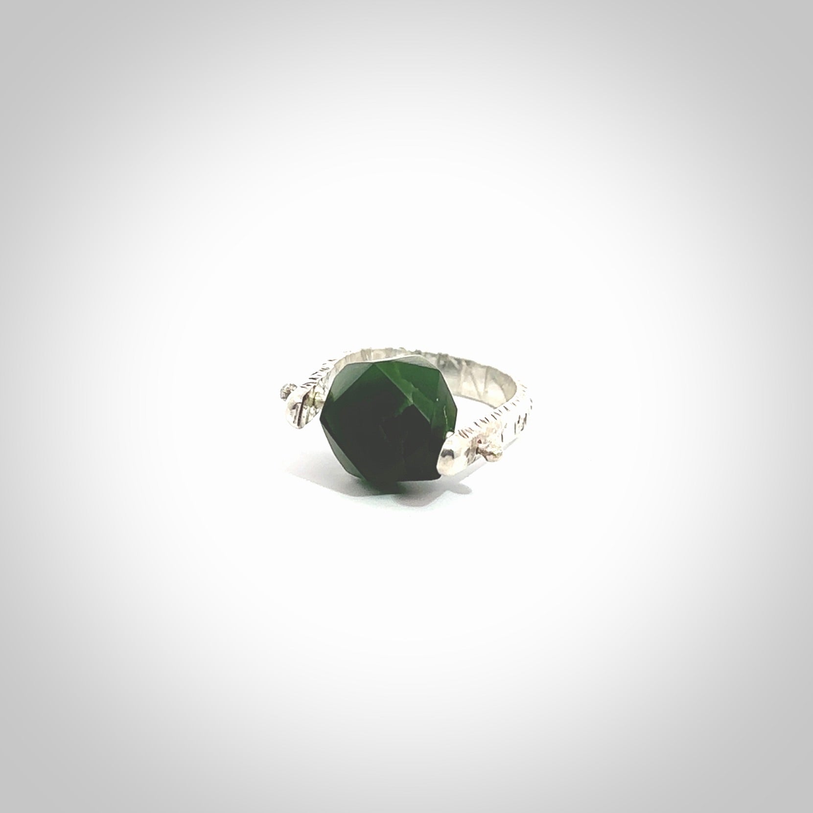 This is a handcrafted New Zealand Pounamu, Jade and sterling silver ring. This is a solid little work of art. We ship this worldwide for free and are happy to answer any questions that you may have about these or other products on our website. Hand made by Ana Krakosky.