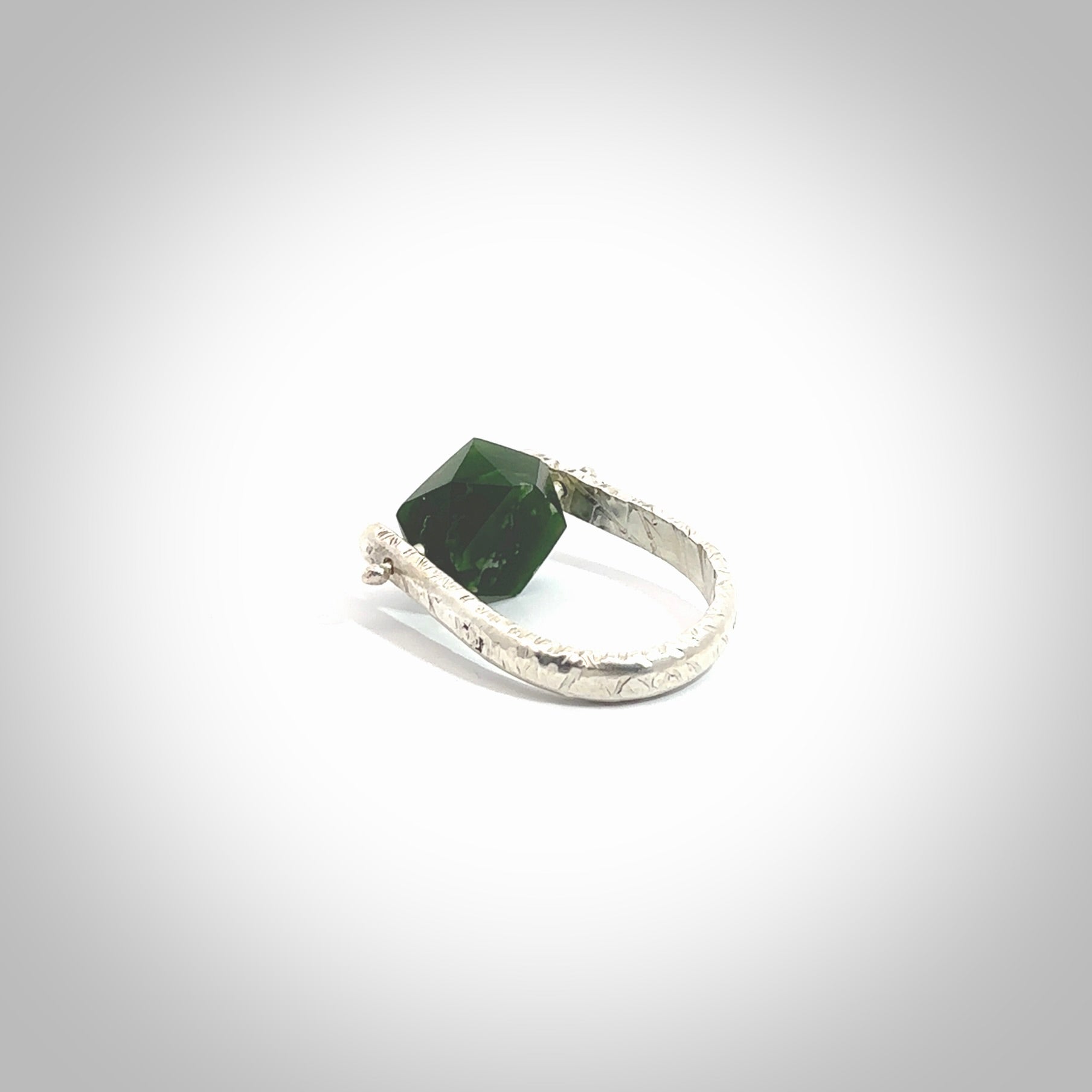 This is a handcrafted New Zealand Pounamu, Jade and sterling silver ring. This is a solid little work of art. We ship this worldwide for free and are happy to answer any questions that you may have about these or other products on our website. Hand made by Ana Krakosky.