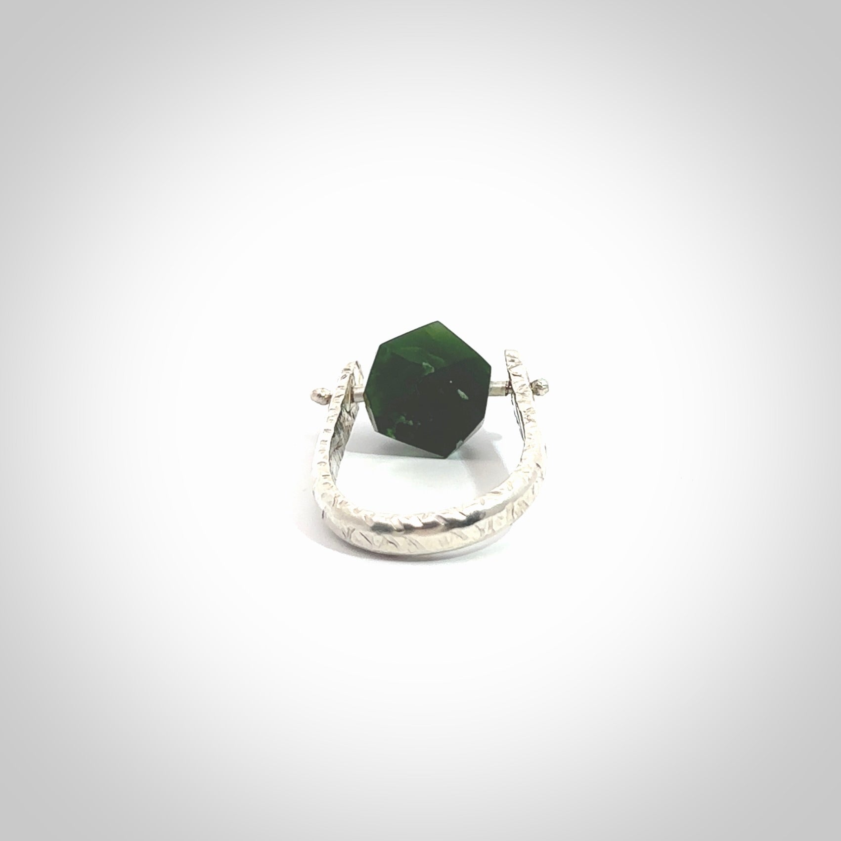 This is a handcrafted New Zealand Pounamu, Jade and sterling silver ring. This is a solid little work of art. We ship this worldwide for free and are happy to answer any questions that you may have about these or other products on our website. Hand made by Ana Krakosky.