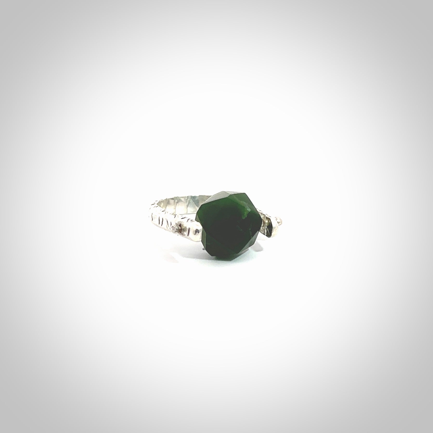 This is a handcrafted New Zealand Pounamu, Jade and sterling silver ring. This is a solid little work of art. We ship this worldwide for free and are happy to answer any questions that you may have about these or other products on our website. Hand made by Ana Krakosky.