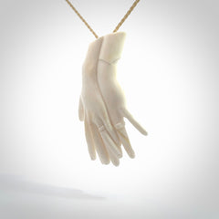 Hand carved large bone double hands with wedding rings pendant. A stunning work of art. This pendant is hand carved in bone and provided with an adjustable cord. A one off work of art to wear by NZ Pacific.