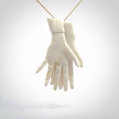 Hand carved large bone double hands with wedding rings pendant. A stunning work of art. This pendant is hand carved in bone and provided with an adjustable cord. A one off work of art to wear by NZ Pacific.