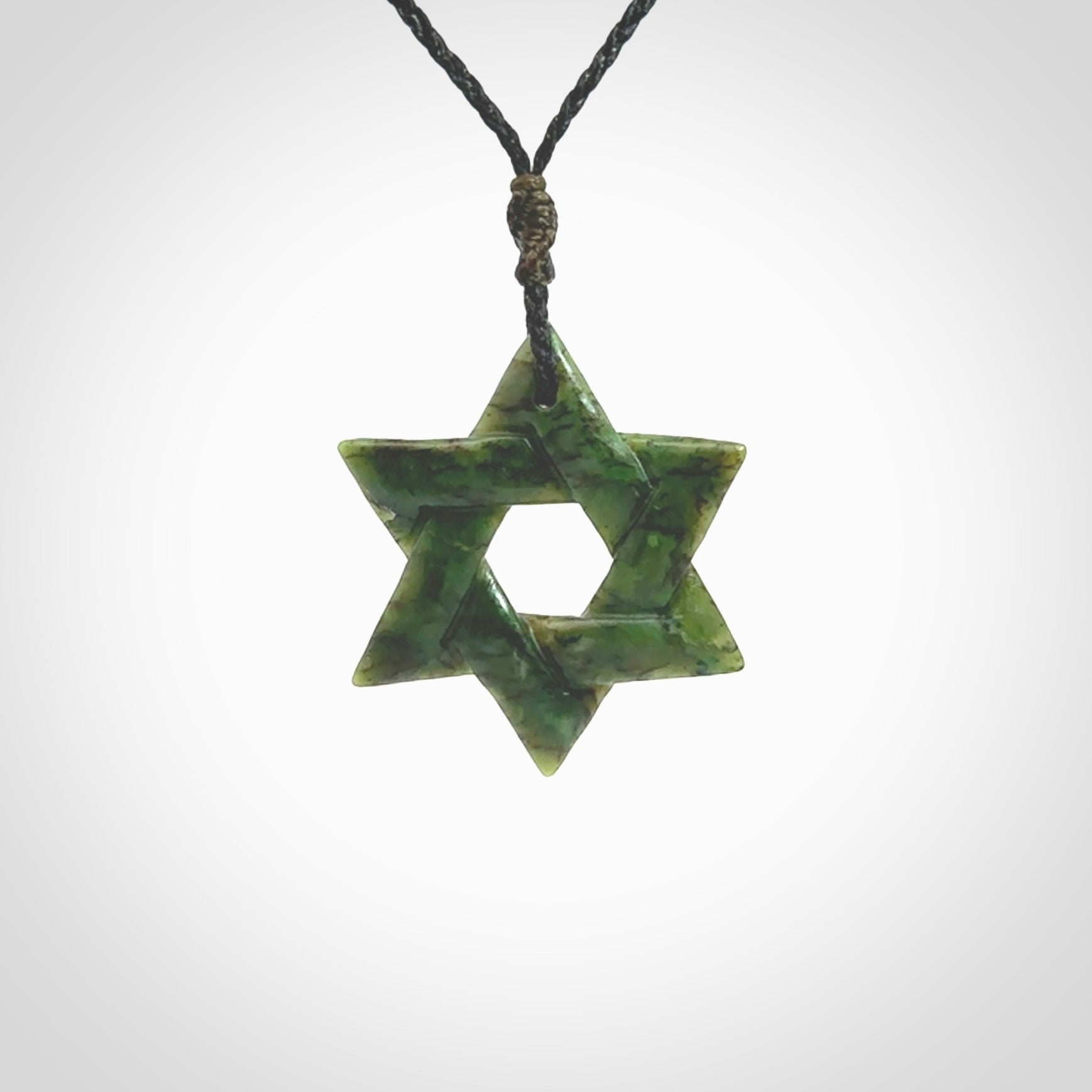 Star of David pendant hand carved from New Zealand Green Jade. Made by NZ Pacific and for sale worldwide. Postage is included in the price.