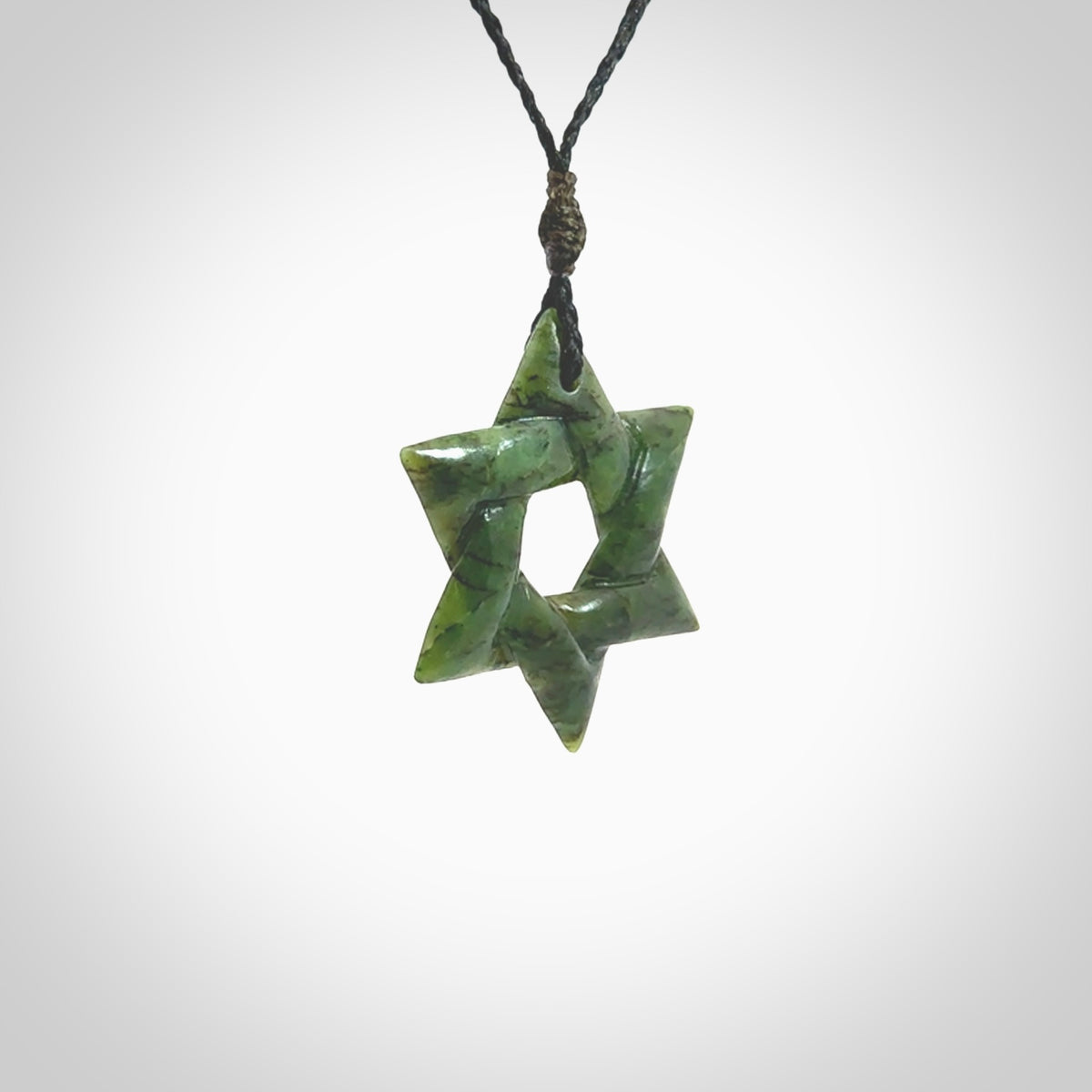 Star of David pendant hand carved from New Zealand Green Jade. Made by NZ Pacific and for sale worldwide. Postage is included in the price.