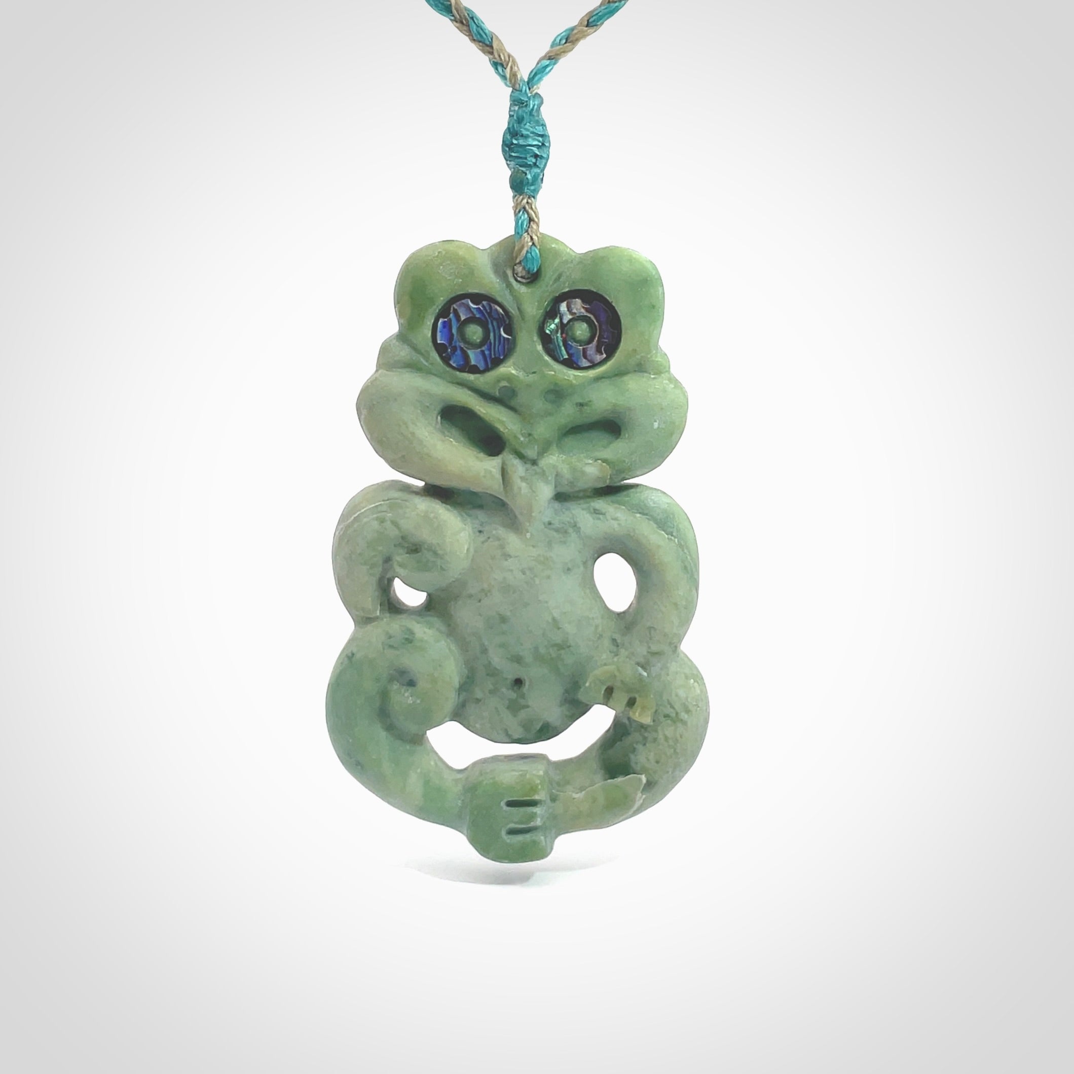 This is a large sized tiki - carved from gorgeous Marsden jade. The craftsmanship is superb, this piece is as well carved as any we have seen. The cord is an adjustable four plaited cord in black. One only by Ana Krakosky.