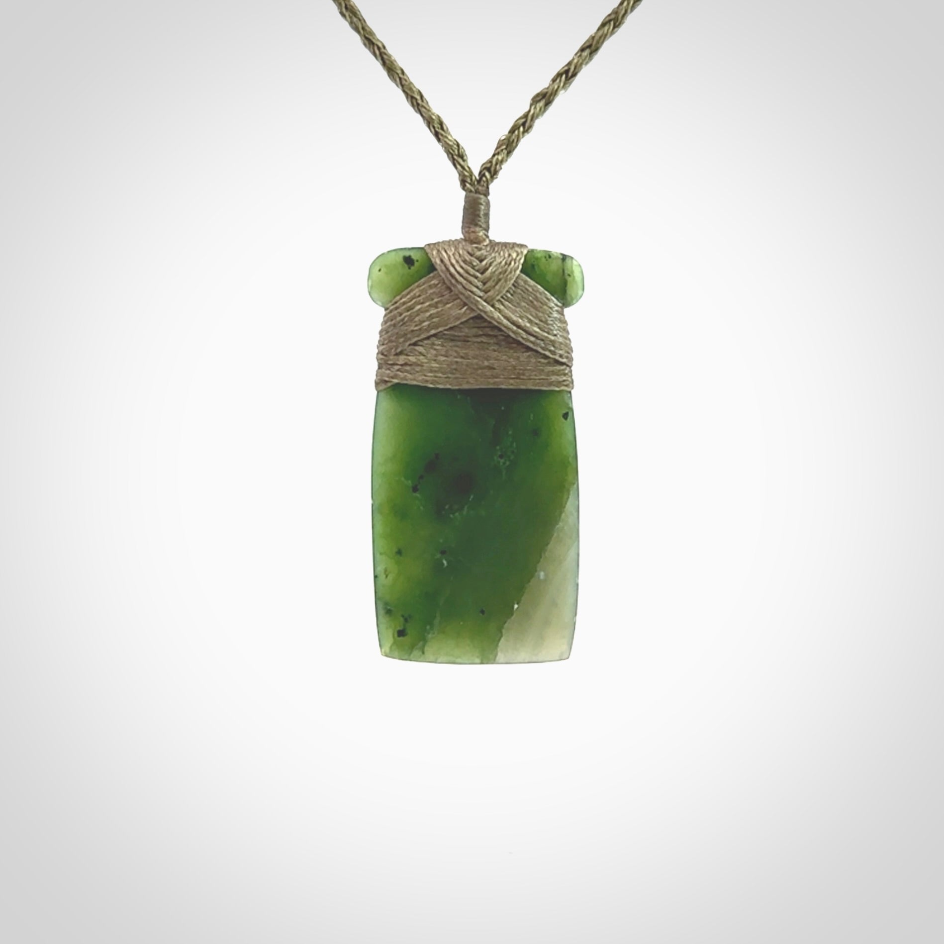 Hand carved jade toki pendant. Carved by NZ Pacific in green jade. Hand made Jade Toki necklace for men and women. Beautiful greenstone Toki with adjustable cord. Delivered to you with Express Courier.