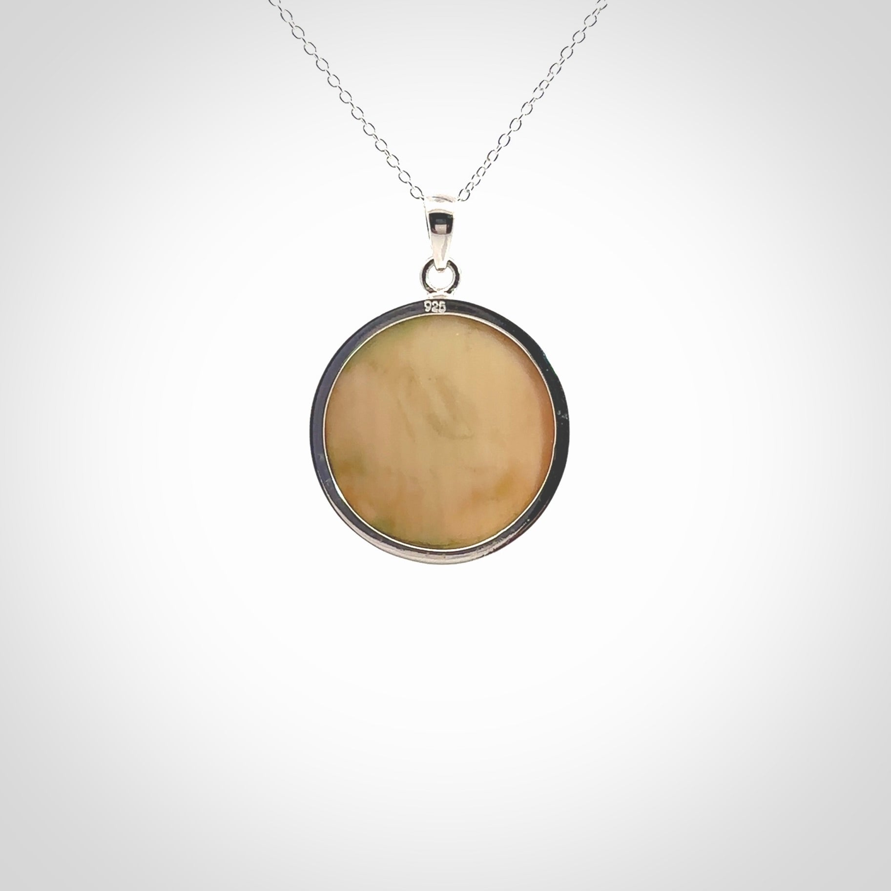 Hand made woolly mammoth tusk moon face necklace. Made by NZ Pacific and sale online only.